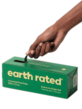 A hand opens a perforated opening of the box